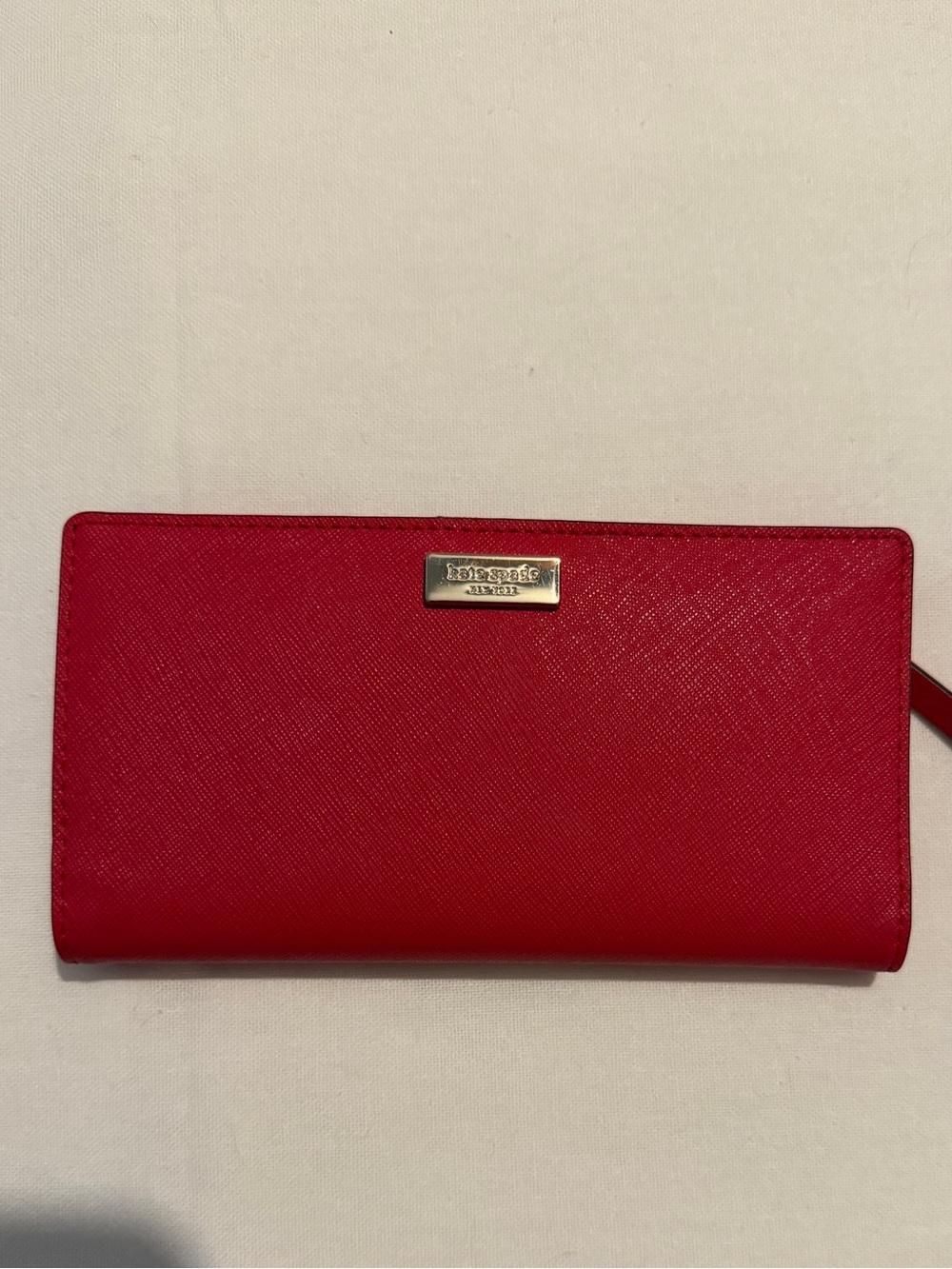 kate spade bright red zip-around saffiano wallet